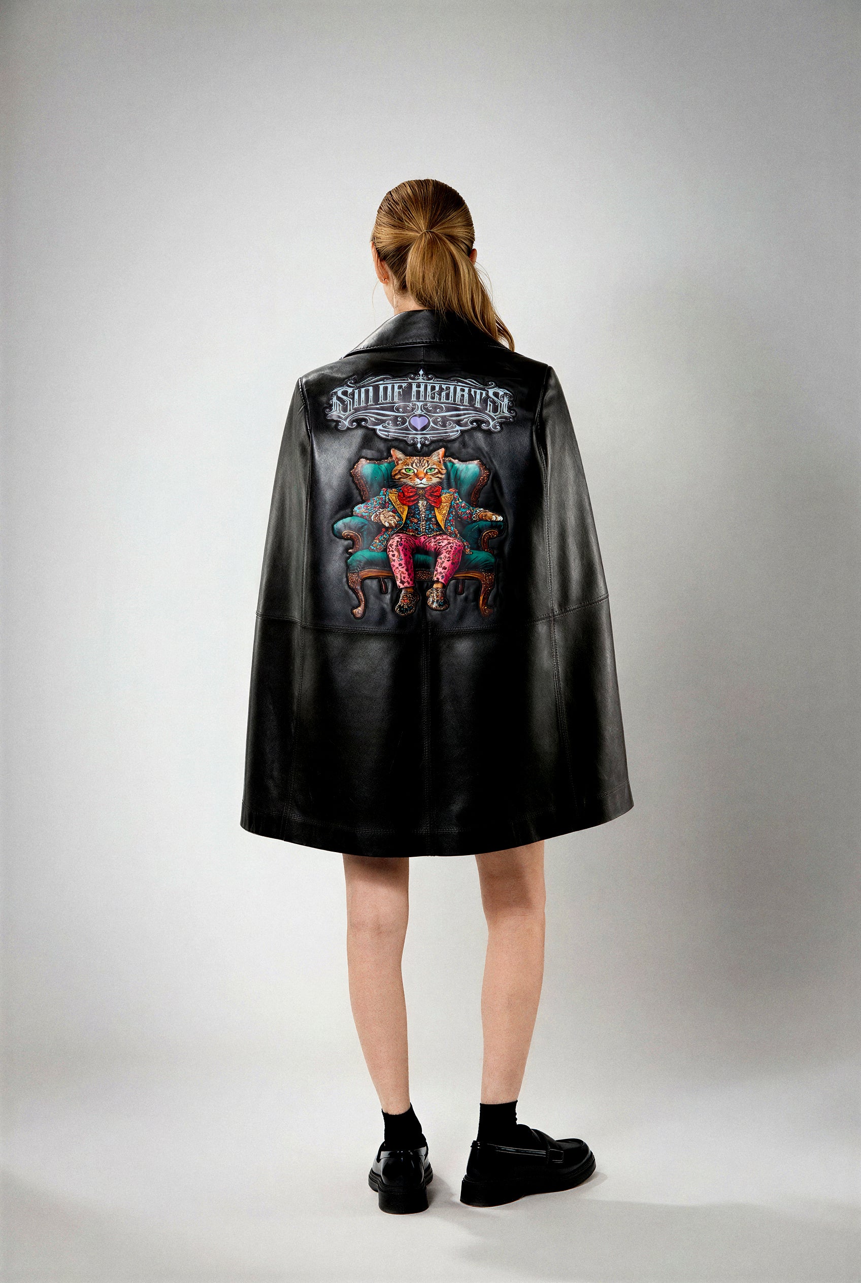 Leather cape with artwork